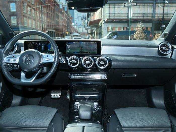 The grabber is the large instrument panel/infotainment screen that extends across the left half of the dashboard.