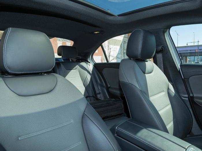 The seats are upholstered in two-tone leather: "Titanium Gray/Black." It