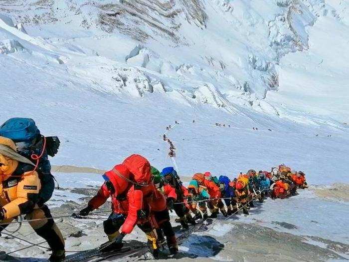 Short windows of good weather can cause traffic jams and overcrowding on the mountain route. Last week, 11 people died waiting to ascend and descend the peak during this season