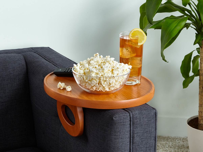 A side table that keeps his TV-watching essentials close by