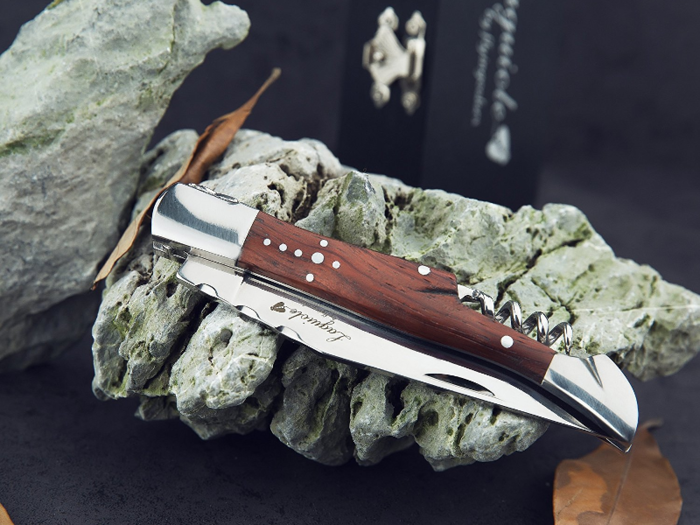 A stainless-steel pocket knife with a rosewood handle and corkscrew.