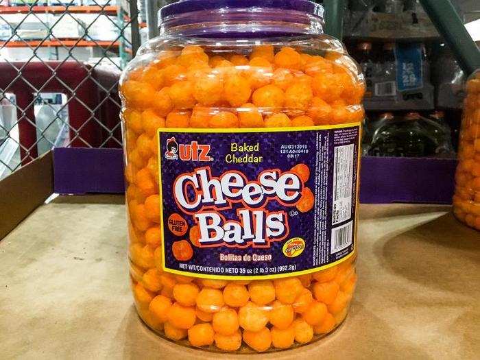 GIANT TUB OF CHEESE BALLS: The ideal use for this two-pound tub of orange cheese balls is sitting on one