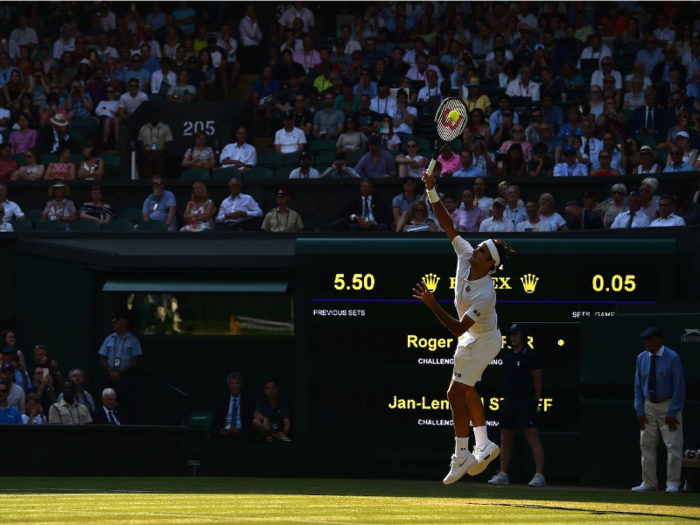 The colors pop in the afternoon shadows of center court at The All England Lawn Tennis and Croquet Club.