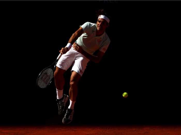 Federer serves out of the shadows at the 2019 Madrid Open.