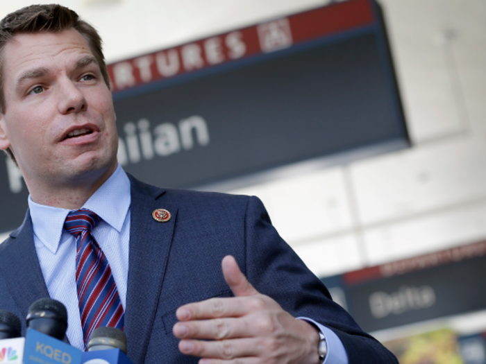 Eric Swalwell tweeted photos of the American flag and the LGBT pride flag hanging over his office door and said, "I fly these flags 365 days a year" — but the LGBT flag still had folding creases in it.