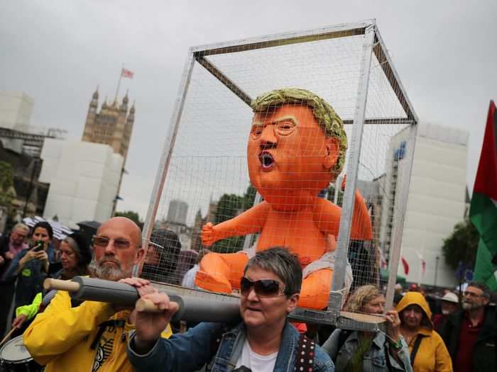 Several other objects were made to follow in the spirit of the "Baby Trump" blimp, including a caged sculpture ...