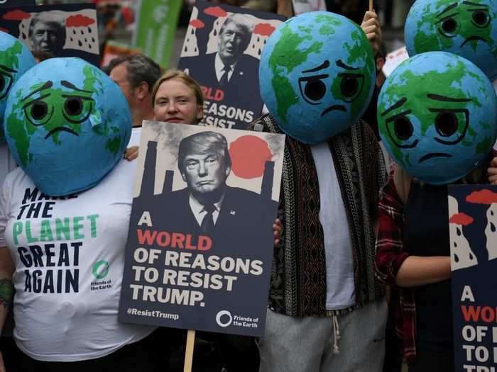 A climate action group employed Earth masks to protest Trump