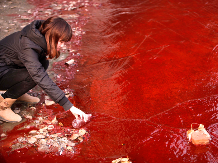 Illegal dumping in waterways can also pose a major health hazard. This river was polluted with red dye from a chemical plant in Luoyang, China.