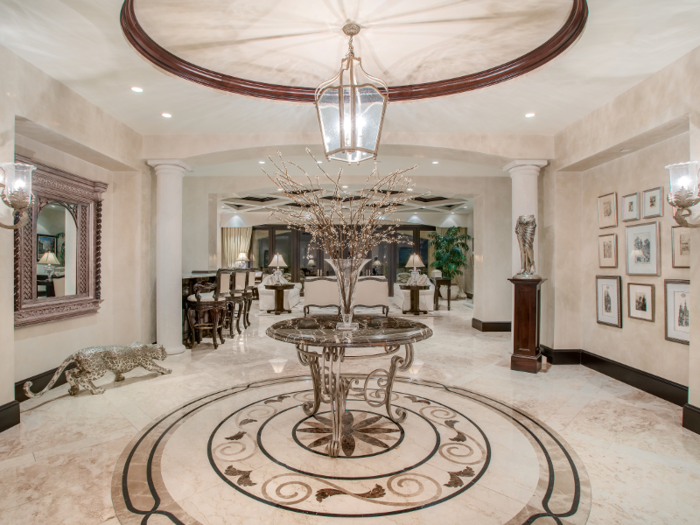 The $11.995 million condo boasts a grand entryway.