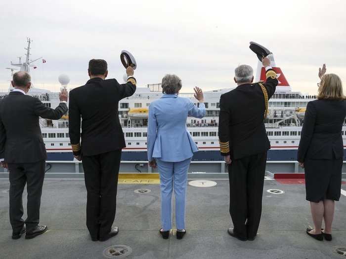 Some 100 miles away, British Prime Minister Theresa May boarded HMS Queen Elizabeth — the country