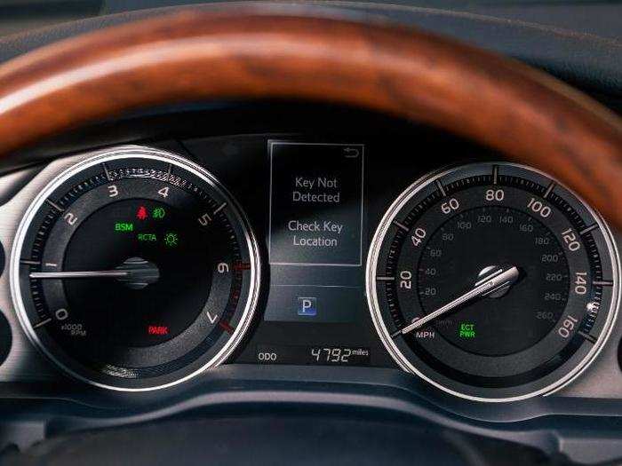 The instrument cluster has old-school analog gauges. And check out that lovely wood-trimmed steering wheel!