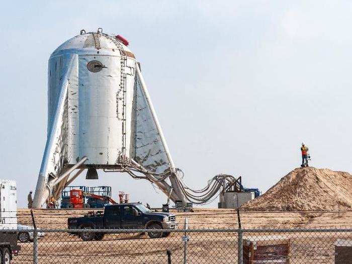 Then they hauled it on top of the giant dirt mound where SpaceX had built a rudimentary launchpad.