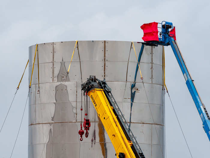 Before long, welders were putting together 30-foot-wide cylinders of polished stainless steel metal.