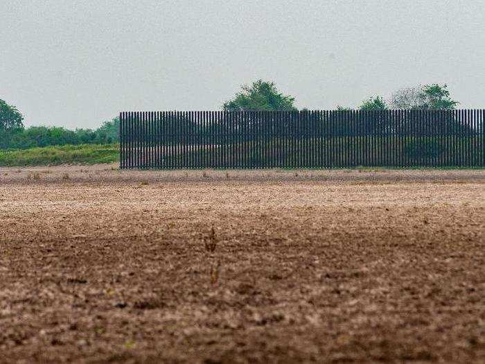 The US-Mexico border wall sits just south of the highway. A few miles into the drive, it abruptly ends.