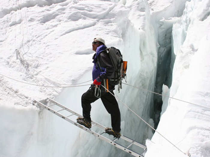 Webster had stepped on an errant piece of ice that sent him flying sideways. He nearly fell into a deadly crevasse, but stopped himself by wedging his elbows sideways. The fall snapped his tibia and fibula.