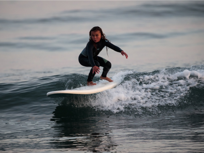 Her daily routine involves a 5 a.m. wake up to go surfing before school.