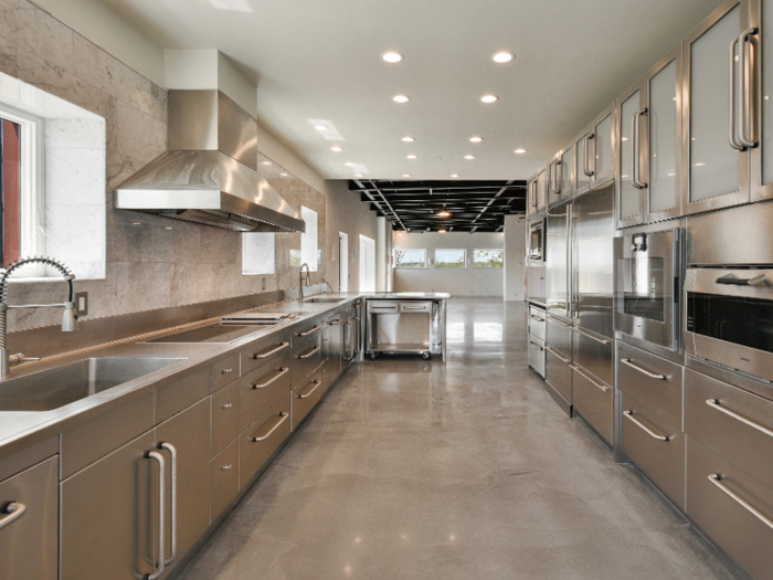 The open kitchen is newly renovated with stainless-steel countertops.