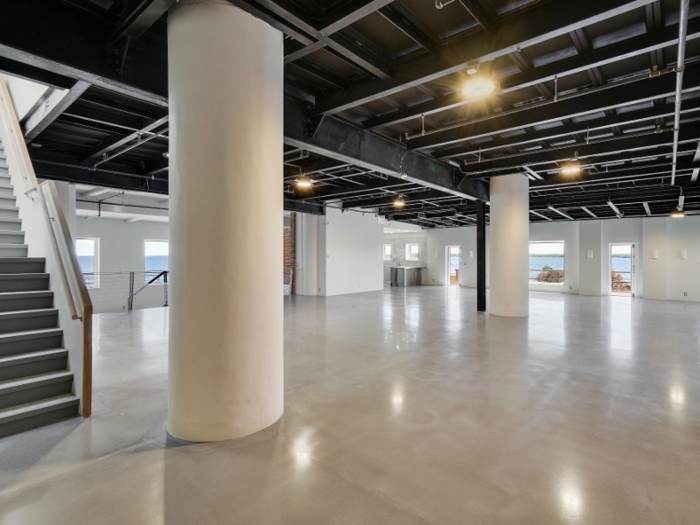 An open floor plan connects the living space to the kitchen, which can be seen in the background of the photo below.