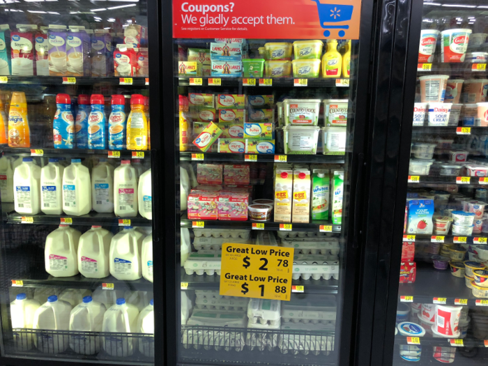 Continuing down the sole refrigerated aisle in the discount store — next to the frozen bread — we found yogurt and a few other dairy products, varieties of butter and butter substitutes, creamers, and cartons of already-beaten eggs. There was also milk and shelled eggs both sporting the "Great Value" label.