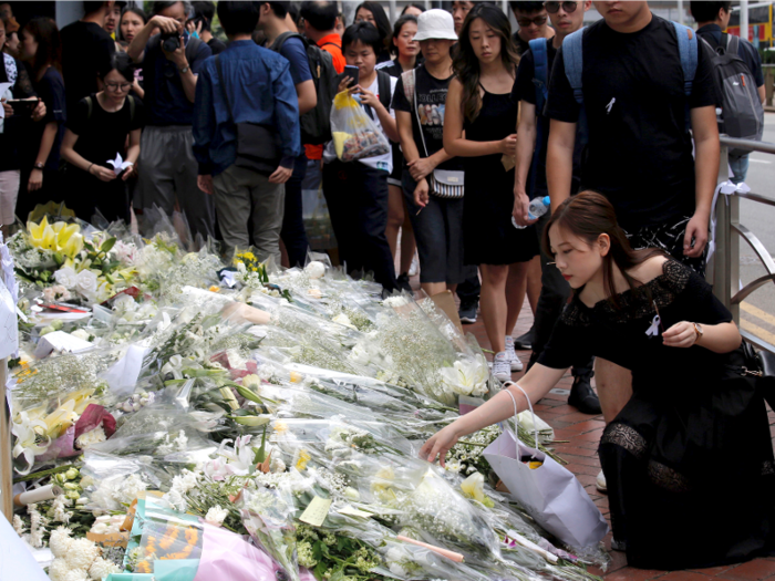 One protestor died after falling from scaffolding in an attempt to hang a banner. That prompted mourners to lay out flowers and other makeshift memorials.