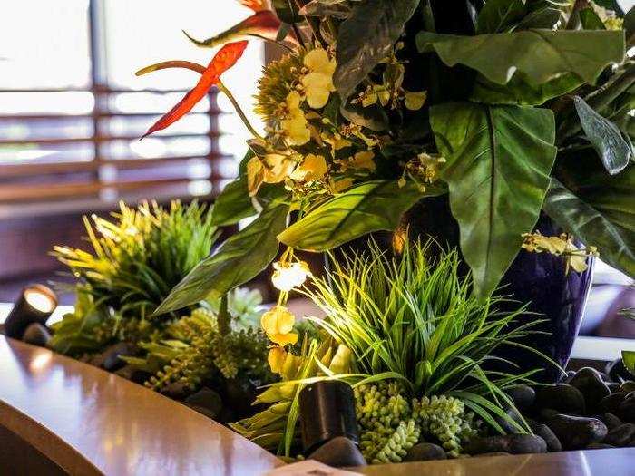 Fake tropical plants sprung from every nook and cranny.