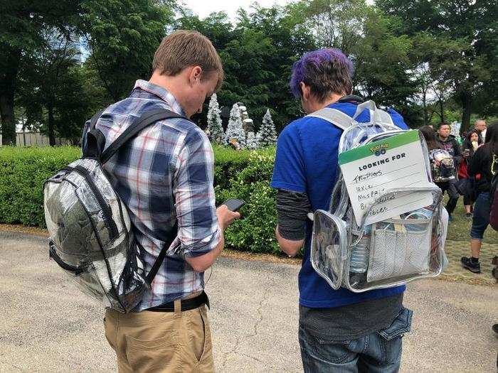 Trainers were given placards on which they could write which specific Pokémon they were looking to trade. Most people I saw had the signs tucked into their hat or pants as they walked around the park, which encouraged people to approach them.