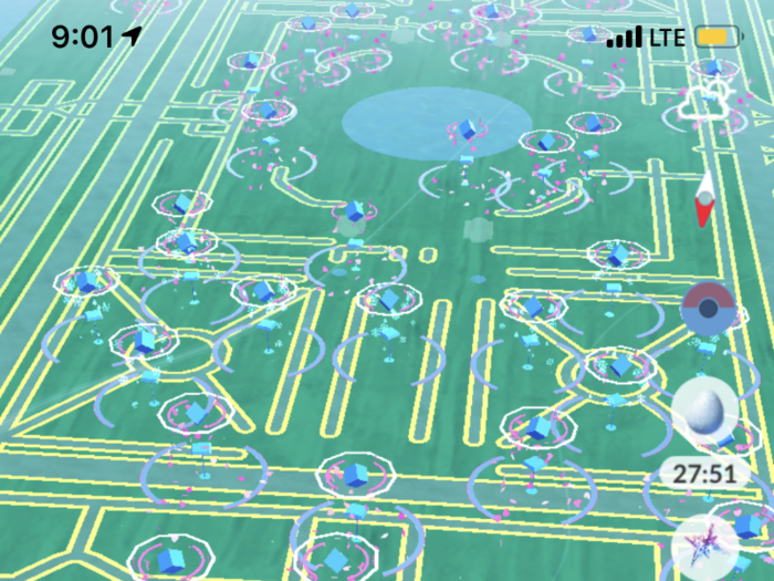 And here is what it looked like after 9am, when it officially started. For the unfamiliar: Each of those blue pillars is a Pokéstop, where players can pick up items. Each and every one here also has a lure to attract wild Pokémon — those are the pink dots.