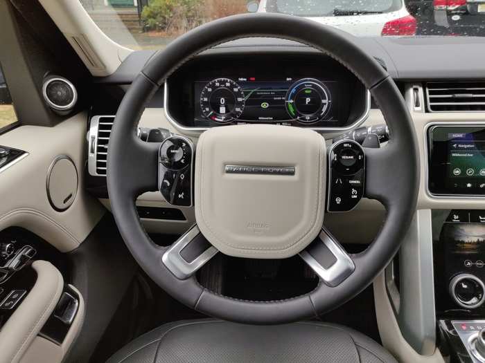 The leather-wrapped and bushed-metal-trimmed steering wheel has the usual button-fest to control systems, and the all-digital instrument cluster goes for old-school gauges with new-school information display.