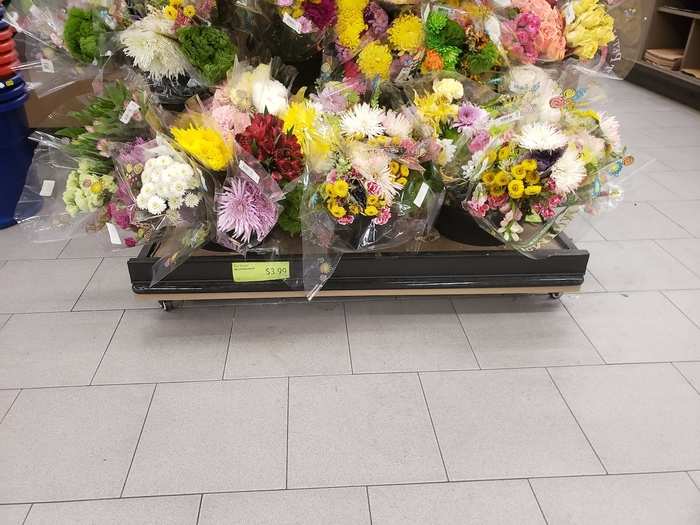 Right down the aisle, you have a nice selection of flowers for $3.99. Not too shabby!