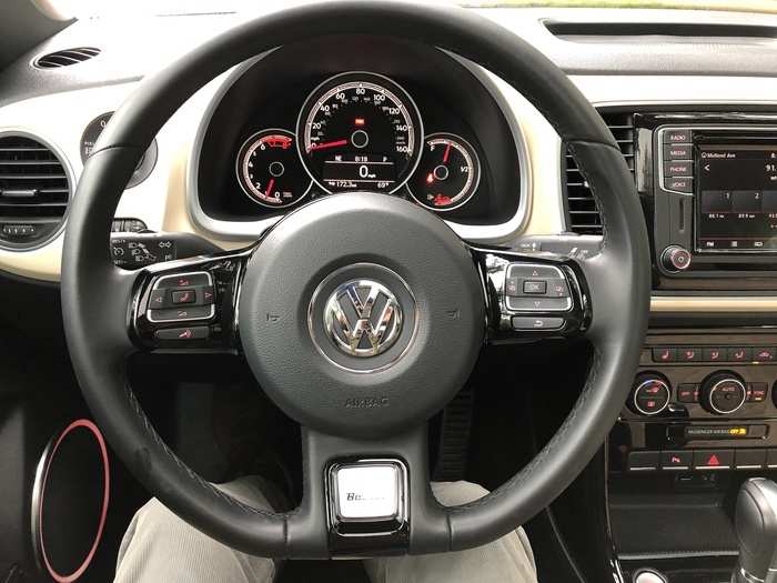 The leather-wrapped, multifunction steering wheel has a nice, thin feel to it — another throwback feature. The Instrument cluster is a straightforward analog affair.