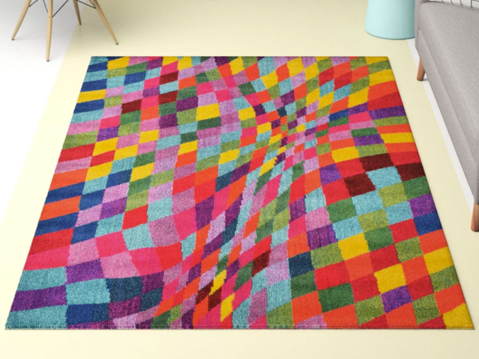 A bold rainbow rug with an optical illusion