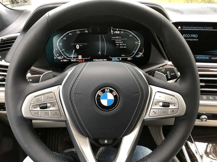 The leather-wrapped multifunction steering wheel has paddle shifters, brushed-metal trim, and affords a view of the 12.3-inch digital instrument cluster.