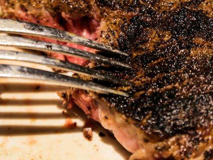 I originally mistook the coating of spice mixture for char, but a scratch of the fork revealed what I already knew from the taste: there was no char. The steak was probably cooked at a lower-than-ideal temperature, which would explain the thick layer of brown around its pink core.