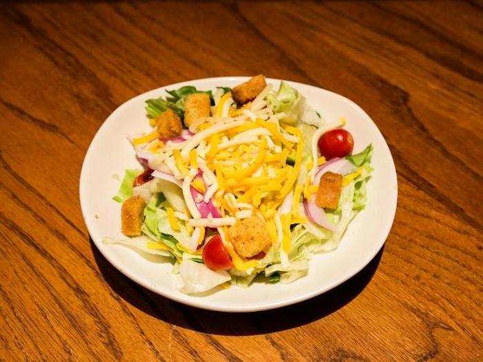 No one comes to a steakhouse for the house salad. But a salad