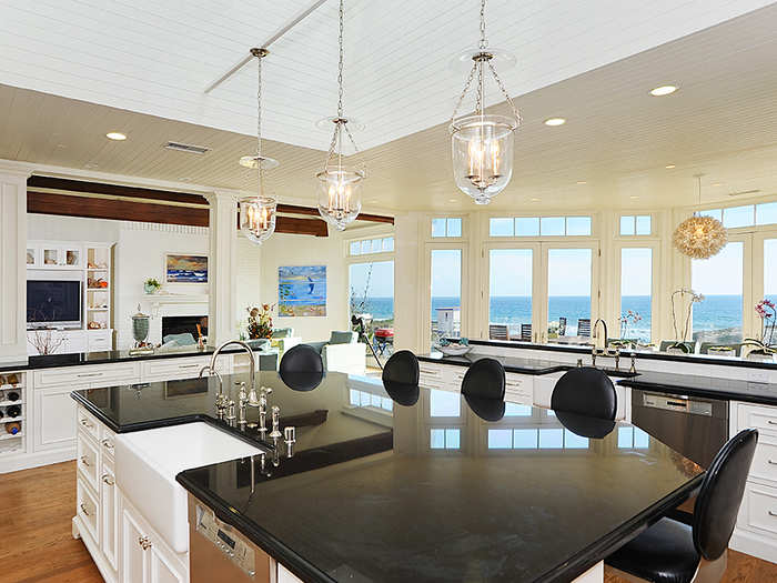 Next to the living room is the industrial-size kitchen that also has views of the beach.