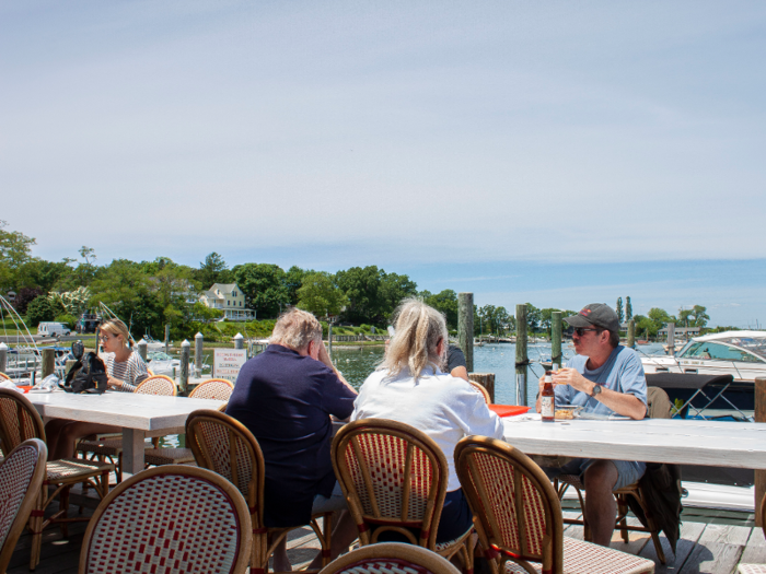 People were sitting outside enjoying the June sunshine and water views.