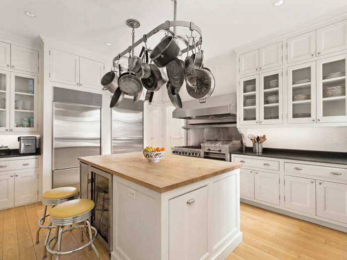 Along with double ovens in the kitchen, it includes a temperature-controlled wine cellar.