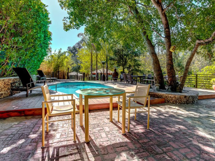 Amenities include a pool, spa, Koi pond, BBQ patio, and seven gazebos.