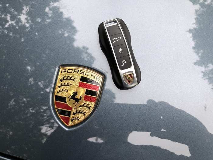 The key fob, naturally, is Porsche-shaped.