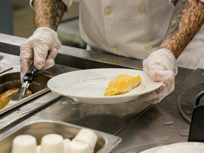 Clad in all white, the stewards scooped heaping portions onto my plates.