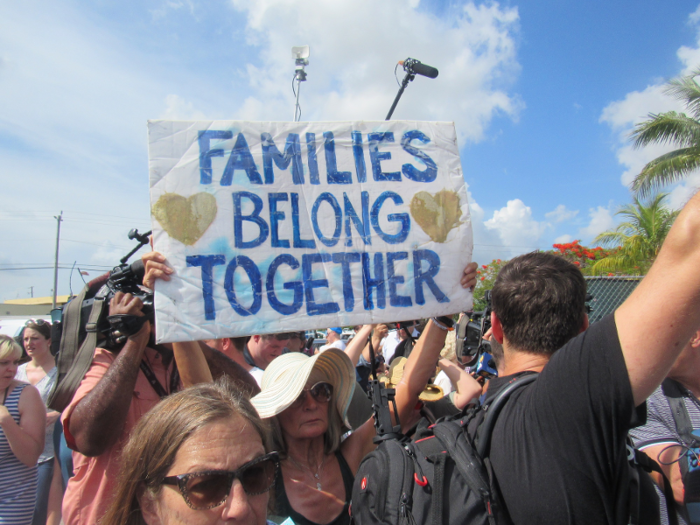 As the senator toured the facility, activists gathered near its entrance.