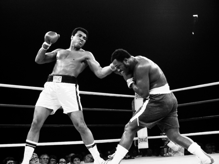 1975: Muhammad Ali beats Joe Frazier in a second rematch in "Thrilla in Manila."