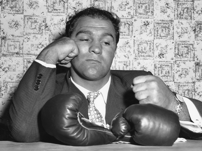 1956: Rocky Marciano retires from boxing undefeated.