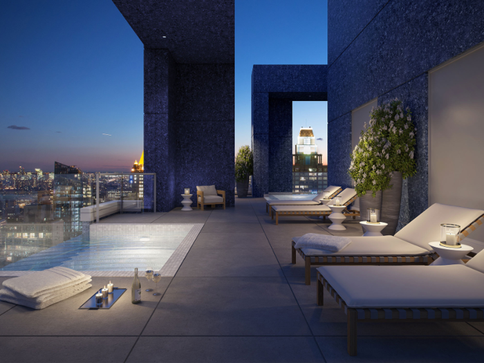 The condo comes with a nearly 3,000-square-foot wraparound private roof deck with a pool and a Jacuzzi.