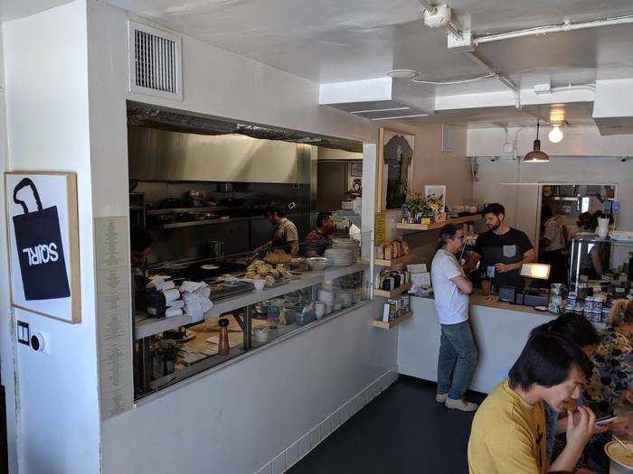 The interior of Sqirl is minimalist and airy. It looks like a large breakfast and lunch spot, because that