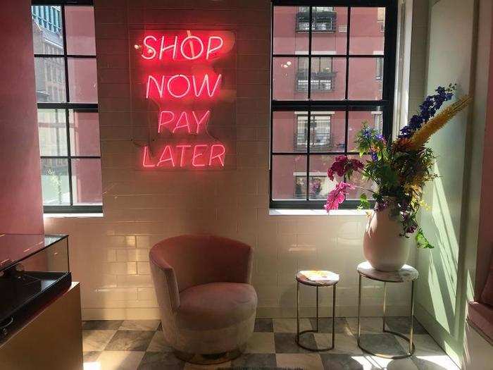 The "Shop now, pay later" sign is for a room devoted to a joint partnership with the payment services provider Klarna and Daniel Wellington watches.