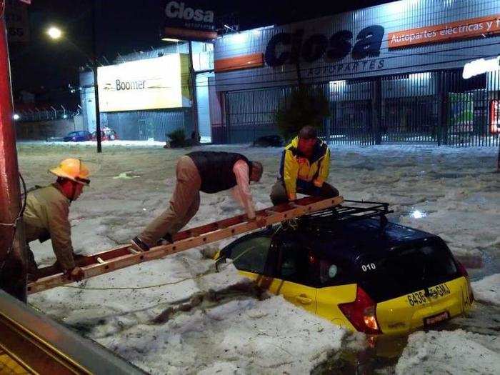 Some people were forced to access cars from above by using a ladder.