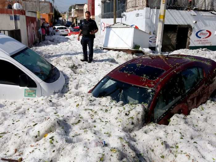 After the hail storm, cars that had been on the streets were half-submerged in ice. At least 50 cars were swept away by the ice in hilly areas, Agence France-Presse (AFP) reported.