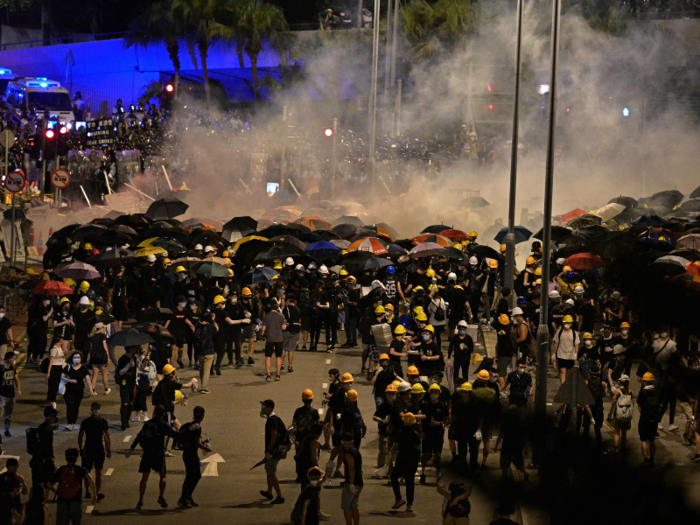 In response, hundreds of police, dressed in full riot gear, stormed the streets around midnight to disperse the protesters from the legislative building. Police used tear gas and batons to empty the streets.