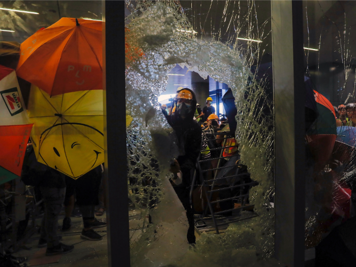 Finally, protesters broke through the glass and swarmed the building.